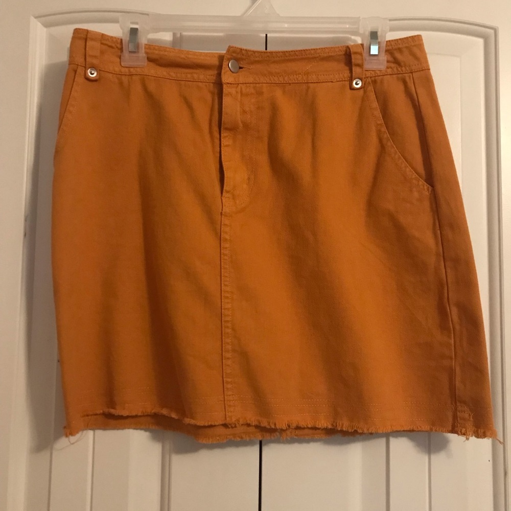 Yellow denim skirt.